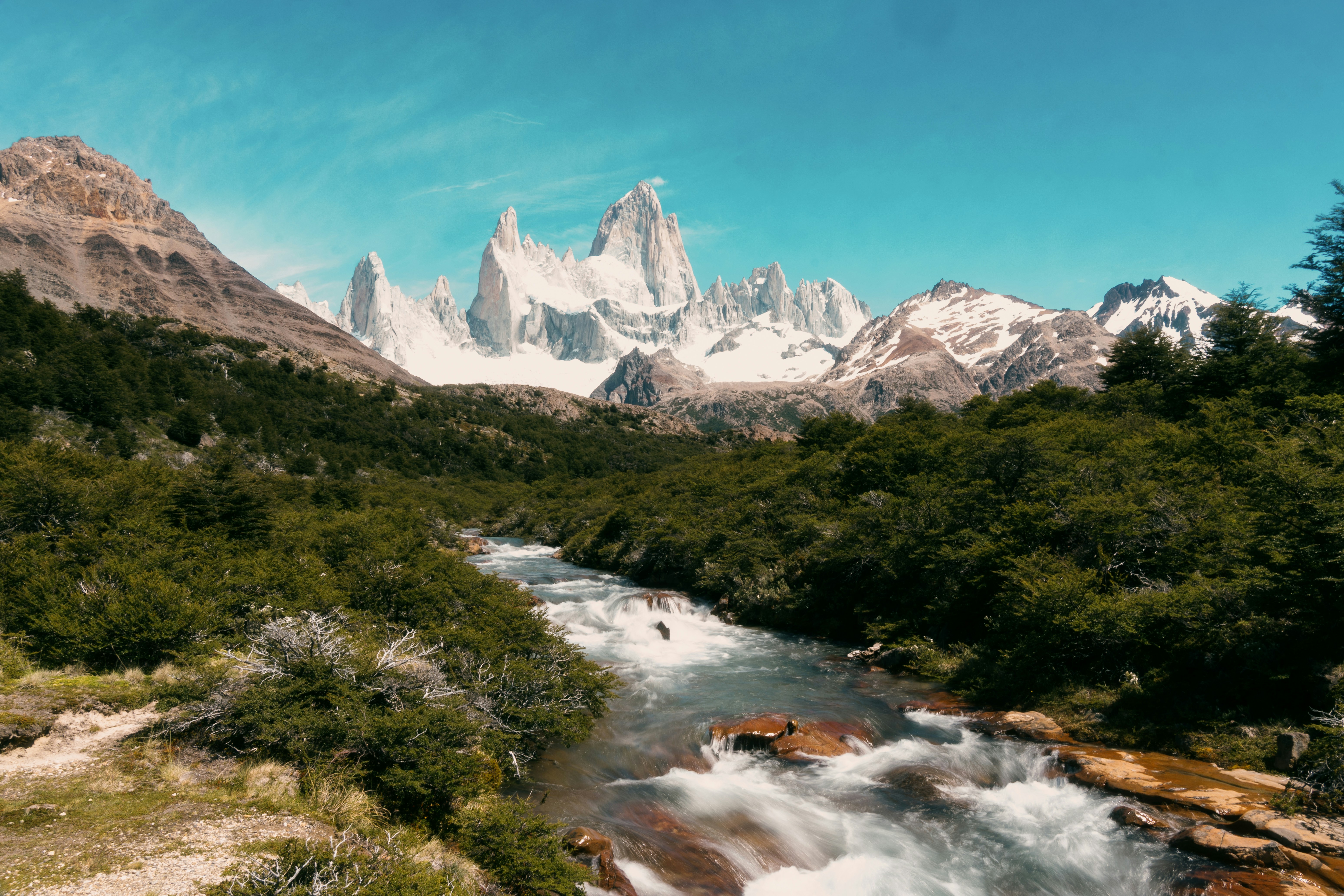 Snow-capped Patagonian peaks above a rushing river